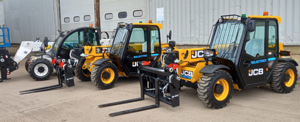 Three electric telehandlers lined up